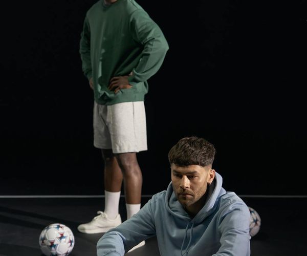 Man performing a warrior yoga pose with confidence and focus.